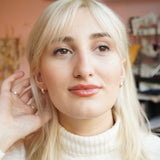 Pair of gold huggy earrings