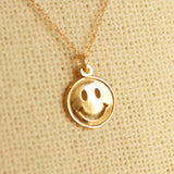 Gold happy face necklace