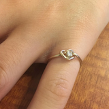 diamond knot ring on finger