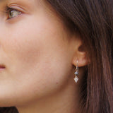 tiny gem earring on model Alex