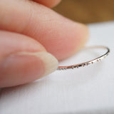 tiny thin silver ring with notched texture