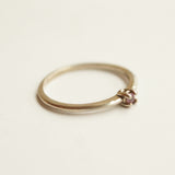 2 mm pink sapphire set in white gold