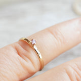 sapphire ring on a finger for scale