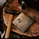 jewellery studio bench stump photo with hammer and anvil