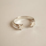 Silver ring with star design.