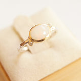 white oval opal ring